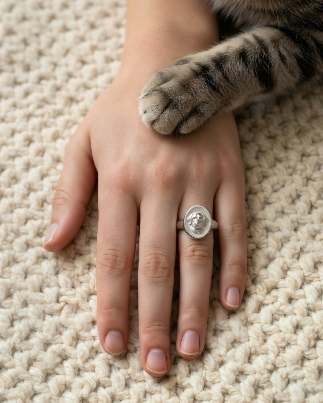 The signet ring beside a cat's paw